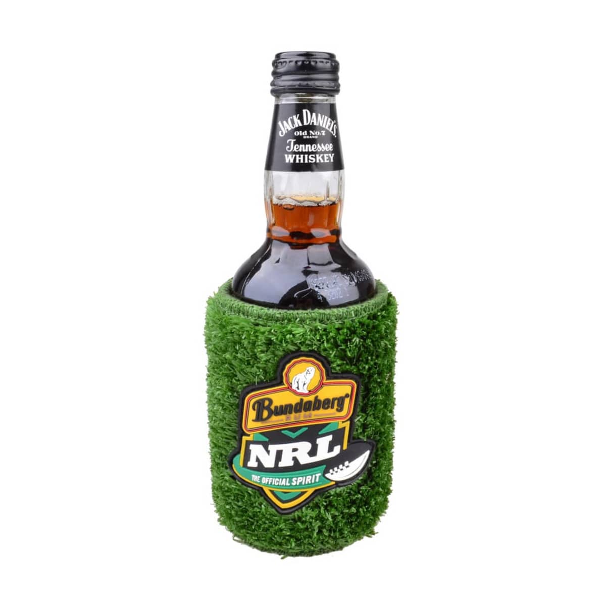 A bottle of Jack Daniels Tennessee Whiskey sits inside a green, grass-textured koozie with Bundaberg NRL branding. The koozie resembles a patch of grass, contrasting with the dark bottle.
