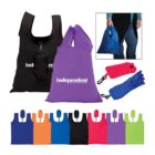 Several reusable shopping bags in various colors, including black, purple, orange, blue, red, and green, are displayed. The purple bag has independent written on it. A small inset shows a person holding the blue bag in hand.