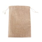 A beige burlap drawstring bag with a simple, textured weave is shown. The bag is closed at the top with two white cords emerging from its side, each tied in a visible knot.