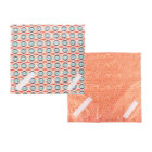 Two colorful cloth squares: one with a geometric pattern of overlapping orange, blue, and white shapes, the other with a small orange and white floral design. Both have white velcro strips on them.