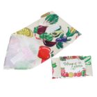 Two reusable sandwich wraps with colorful fruit and vegetable patterns. One wrap is open, displaying its interior, and the other is folded, revealing the text Wrap it Green on a beige background.