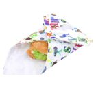 A hamburger with lettuce and a sesame seed bun is wrapped in a colorful napkin featuring various illustrated alphabet letters and animals.