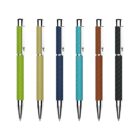 Six ballpoint pens with textured grips in green, light green, blue, dark blue, brown, and dark brown are lined up against a white background. Each pen features silver accents.