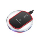 A round wireless charger with a black and red design labeled FANTASY Wireless Charger. It has a clear outer rim and an attached black cable.