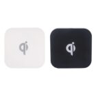 Two square-shaped Qi wireless charging pads, one white and one black, each displaying the Qi symbol in the center, set against a plain white background.