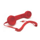 A red retro-style telephone handset with a coiled cord ending in a 3.5mm audio jack connector, isolated on a white background.