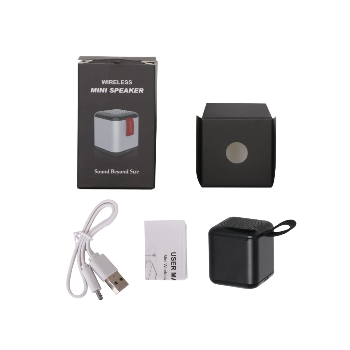 Wireless mini speaker product package. Includes a black speaker with a loop handle, a USB charging cable, a user manual, and a black box featuring an image of the speaker on the front with the text Sound Beyond Size.