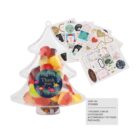 A clear, tree-shaped container filled with colorful candies and a Thank you label. Beside it are various sheets of customizable stickers featuring festive designs, hearts, and messages.