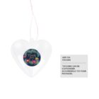 Clear heart-shaped ornament with a string, featuring a circular sticker that says Thank you in floral design. Text beside it reads, ADD ON STICKERS and *STICKERS CAN BE CUSTOMIZED ACCORDINGLY TO YOUR PACKAGES.