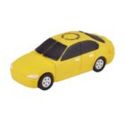 A small, toy model of a yellow car with black tinted windows and white wheels, viewed from a slightly elevated angle. It has the appearance of a taxi with Taxi Cab text on the roof. The background is plain white.