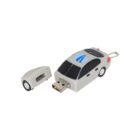 A USB flash drive shaped like a small car, with a gray body and blue accents. The front of the car is detached, revealing the USB connector. A keychain loop is attached to the rear.