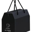 A black box with rope handles featuring a simple outline of a coffee cup and the text po di fame and little hungry. The box is designed to hold two 310 ml aroma coffee cups.