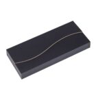 A black rectangular box with a gold wavy line design across the top.