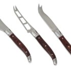 Three cheese knives with wooden handles are displayed. The set includes a flat spreading knife, a perforated knife with forked tips, and a curved slicing knife. Each handle features a dark wood grain with metal accents. The background is white.