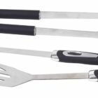 A set of stainless steel barbecue tools including tongs, a fork, and a spatula, each with black rubber handles. The tools are arranged in a row against a white background.