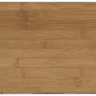 A rectangular bamboo cutting board with a smooth surface and visible wood grain patterns. The color is a natural, light brown.