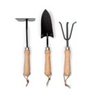 Three garden tools displayed are a hoe, a trowel, and a cultivator. Each tool has a shiny black metal head and a smooth wooden handle with a hanging loop. They are neatly arranged side by side against a white background.