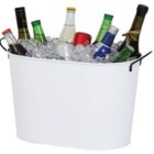 A white metal ice bucket filled with assorted bottled and canned beverages, surrounded by ice. The drinks vary in colors and sizes, indicating a mix of alcoholic and non-alcoholic options.