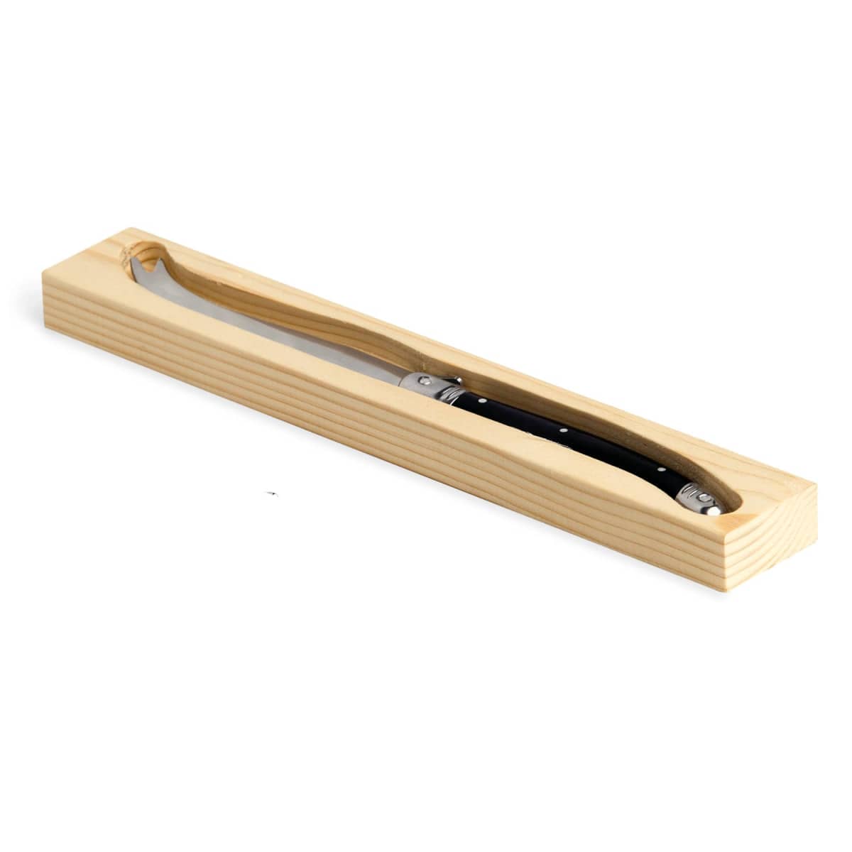 A folding knife with a black handle is displayed in an open wooden box.