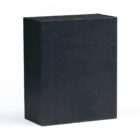 A plain, rectangular black box stands upright against a white background, casting a slight shadow. The box has a smooth surface with no visible markings or designs.