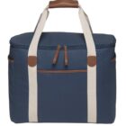A blue tote bag with beige handles and brown leather accents. It features a zippered main compartment, a front pocket, and two side pockets. The handles have a brown leather grip at the top.