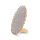 A round, modern speaker with a fabric front and wooden frame, standing on a wooden base at a slight angle. The fabric is light gray, and the wooden elements have a natural finish.