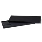 A black knife box with its lid partially open, revealing a large chefs knife inside. The box has a sleek, minimalist design.