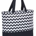 A black and white chevron-patterned tote bag with black handles and a solid black bottom compartment featuring a zippered pocket.
