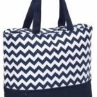A tote bag with a navy blue and white chevron pattern on the top section and solid navy at the bottom. It has two navy handles and a zippered pocket on the bottom section.