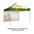 A colorful marquee tent with a tropical theme, featuring a printed full side wall that displays images of sunscreen products. The tent is supported by four metal poles. Text reads: Marquee with 1 side 3M full wall (single side printed).