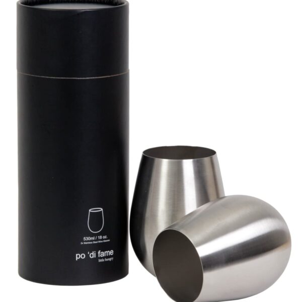 A black cylindrical box labeled 530ml / 18oz. stands next to two stainless steel, stemless wine glasses, one upright and one tilted on its side.