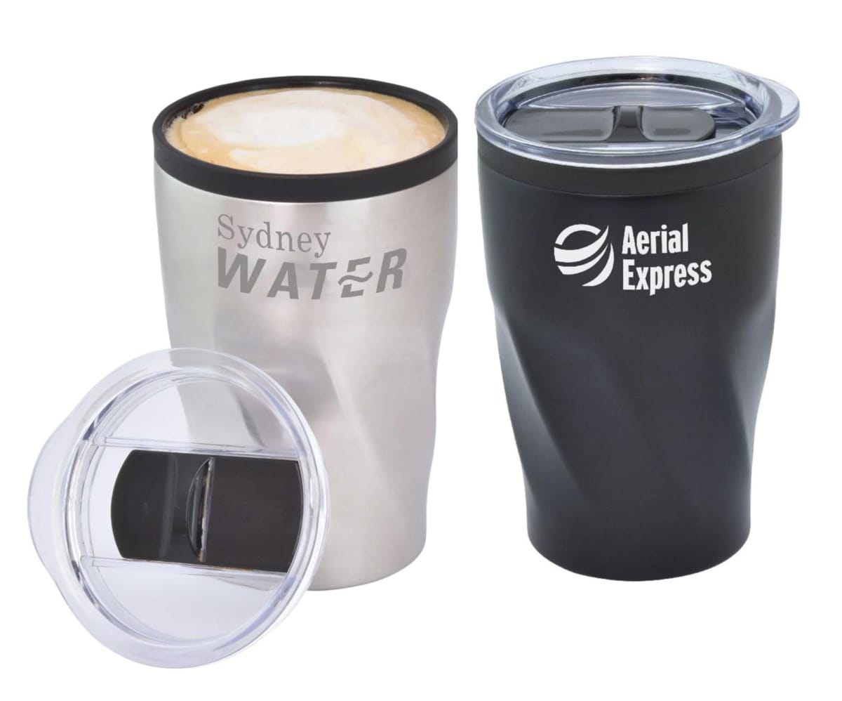 Two travel mugs with lids. One mug is silver with Sydney WATER text and filled with a frothy beverage. The other is black with Aerial Express text and is closed. A transparent lid is shown separately on the side.