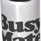 A silver water bottle with a black flip-top lid. The words Busy Mate Industries are printed in bold black letters on the side.