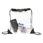 A clear drawstring bag containing a smartphone, a tube of sunscreen, a box of tissues, a pair of sunglasses, and a set of keys. The bag has black strings and black reinforced corners.