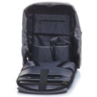 Open grey backpack showing organized compartments with visible laptop, tablet, and a charging bank. The interior has a sleek, padded design with multiple pockets for organization and tech storage.