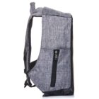 Side view of a gray backpack with a textured fabric design, featuring a black zipper pocket on the side. The shoulder strap is padded, and the bottom has a black, water-resistant material.