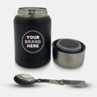 A black thermos with a customizable Your Brand Here label is shown. The lid is off, revealing a silver interior step. A metal folding spoon is positioned in front of the thermos, and the lid rests beside it.