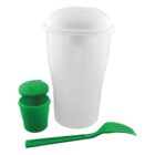 A white plastic cup with a lid is placed next to a small green container with a hinged lid and a green plastic fork. The items are set against a plain white background.