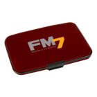 A rectangular, dark red metal case with rounded edges and a black clasp. The text FM7 and Frontier of New Material is printed on the lid in gray and orange.