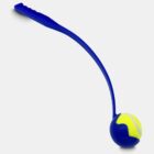 A blue plastic dog ball launcher with a long handle and a yellow tennis ball securely held at the end.