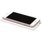 A smartphone with a rose gold frame and black screen is placed on top of a white portable power bank. The phones screen is off, and the power bank features a charging port on the side.