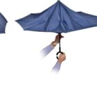 A sequence showing a blue umbrella being opened and closed. The first image displays the fully open umbrella, the second shows it partially closing, and the third depicts it completely folded, with a hand holding the handle throughout.