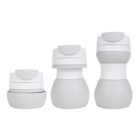 Three collapsible containers of different heights arranged side by side. Each container has a gray base and a white lid with a gray tab for opening. The containers are aligned from shortest to tallest.