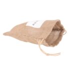 A small, beige jute drawstring pouch with a white label on its front. The pouch is open, revealing its textured fabric and drawstring closures.