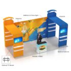 A trade show booth featuring two colorful display stands, orange and blue, with shelves and optional TV mounts. A person stands at a counter with the Brand logo, in front of a backdrop advertising orange juice with added arm lighting.