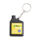 Keychain in the shape of a small black engine oil bottle with a yellow label, featuring ACDelco branding. The label also includes engine oil specifications and a metal keyring is attached to the bottles cap.