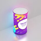 A cylindrical object with a vibrant purple, yellow, and blue abstract geometric design, labeled ABSTRACT Geometric Colorful background. It stands on a pale surface, casting a soft glow.