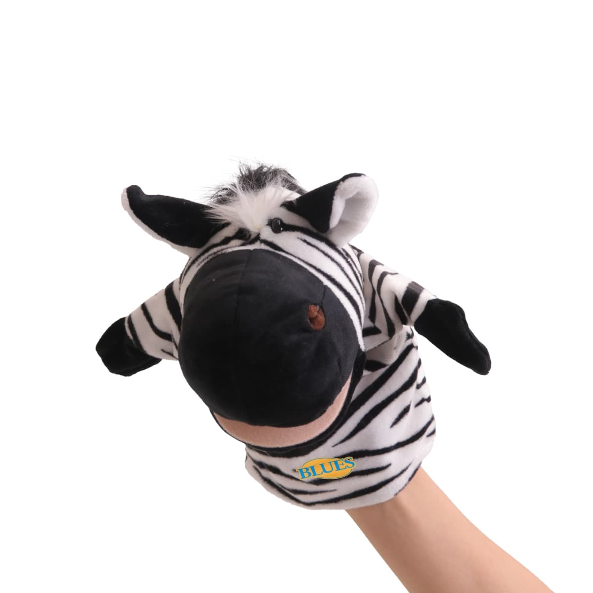 A hand is wearing a black and white zebra puppet with small ears and a furry mane. The word BLUES is embroidered on the puppets body. The background is plain white.
