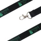 A black lanyard with green text and graphic designs reads Developer Developer Developer! and Perth in two sections. It features a metal clip for attachment. The lanyard is laid out on a white background.