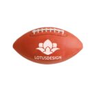 An American football with a textured brown surface, white laces, and a logo featuring a lotus flower above the text LOTUSDESIGN.